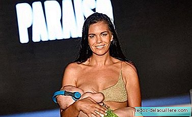 A model breastfed her five-month-old daughter while parading on a catwalk