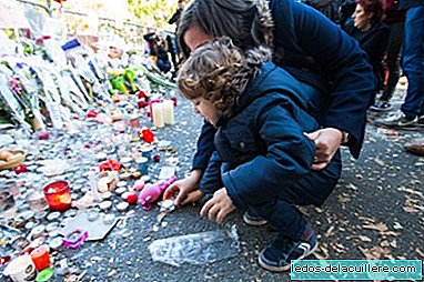 A father explains to his son that flowers can do more than weapons after the attacks in Paris