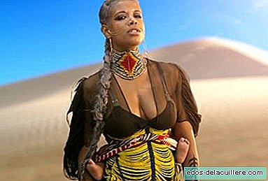 Singer Kelis shows her baby in a baby carrier in her latest video clip